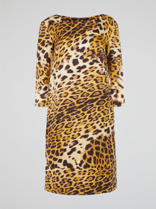 Release your inner wild side with the Yellow Leopard Print Dress by Clas Roberto Cavalli. Roaring with style, this dress boasts a fierce leopard print pattern in a striking yellow hue that is sure to turn heads. With its body-hugging silhouette and luxurious fabric, this dress is the perfect statement piece for any glamorous occasion.