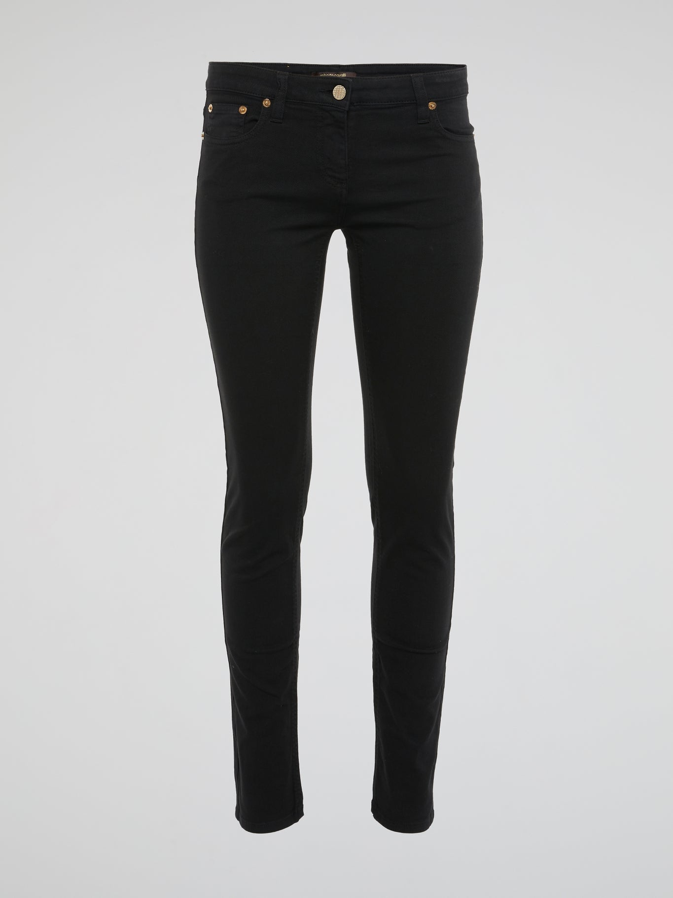 Elevate your style with these sleek and edgy Black Skinny Jeans by Roberto Cavalli - crafted for the fashion-forward individual who isn't afraid to make a bold statement. The figure-hugging fit and luxe detailing will have heads turning wherever you go, effortlessly taking you from day to night in style. Embrace your inner trendsetter with these must-have jeans that exude confidence and sophistication.