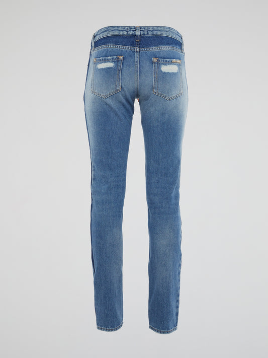 Wrap yourself in urban-chic style with our Scarf Belted Distressed Denim Jeans by Roberto Cavalli. The statement scarf belt adds a touch of bohemian flair to these edgy jeans, perfect for the fashion-forward individual. Stand out from the crowd and make a lasting impression with this unique and personal denim piece.