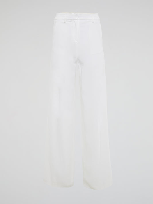 Elevate your style with these stunning white palazzo pants from Roberto Cavalli, designed to make you stand out from the crowd. The luxurious fabric drapes elegantly as you move, creating a sophisticated silhouette that is both comfortable and chic. Perfect for a day at the beach or a night on the town, these palazzo pants are a must-have addition to your wardrobe.