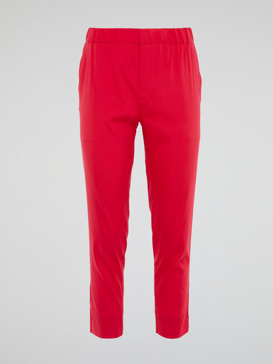 Unleash your inner wild side with the vibrant red hue of these Roberto Cavalli elasticated waist pants, designed to make a bold statement wherever you go. The luxurious fabric and impeccable tailoring ensure a flattering fit that's both comfortable and stylish, perfect for adding a touch of Italian glamour to your wardrobe. Elevate your everyday look with these eye-catching pants that exude confidence, sophistication, and a touch of playful eccentricity.