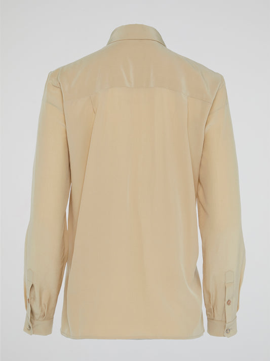 Elevate your wardrobe with the ultimate in luxury and sophistication - the Beige Lace Up Blouse by Roberto Cavalli. Crafted with exquisite attention to detail, this blouse features intricate lace detailing and a flattering silhouette that is sure to turn heads. Embrace your inner fashionista and effortlessly elevate any outfit with this chic and timeless piece.