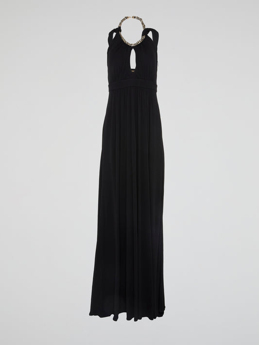 Elegance meets edgy in this show-stopping Black Crystal Embellished Halter Neck Maxi Dress by Roberto Cavalli. Adorned with shimmering crystals that catch the light with every step, this dress is sure to turn heads at any event. Whether you're hitting the red carpet or dancing the night away, this dress will make you feel like a true fashion icon.