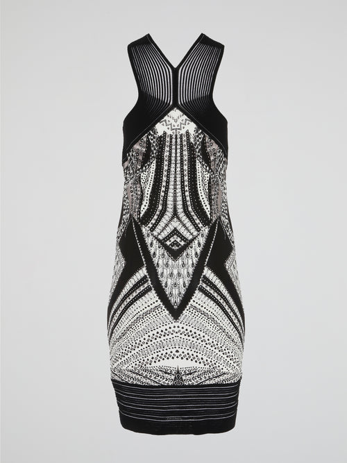 This Tribal Print Sleeveless Dress by Roberto Cavalli merges the wild spirit of nature with the elegance of high fashion. Its vibrant and intricate tribal patterns transport you to faraway lands, while the sleek and effortless silhouette ensures a showstopper look. Indulge in this masterpiece that captures the essence of adventure and sophistication in every stitch.