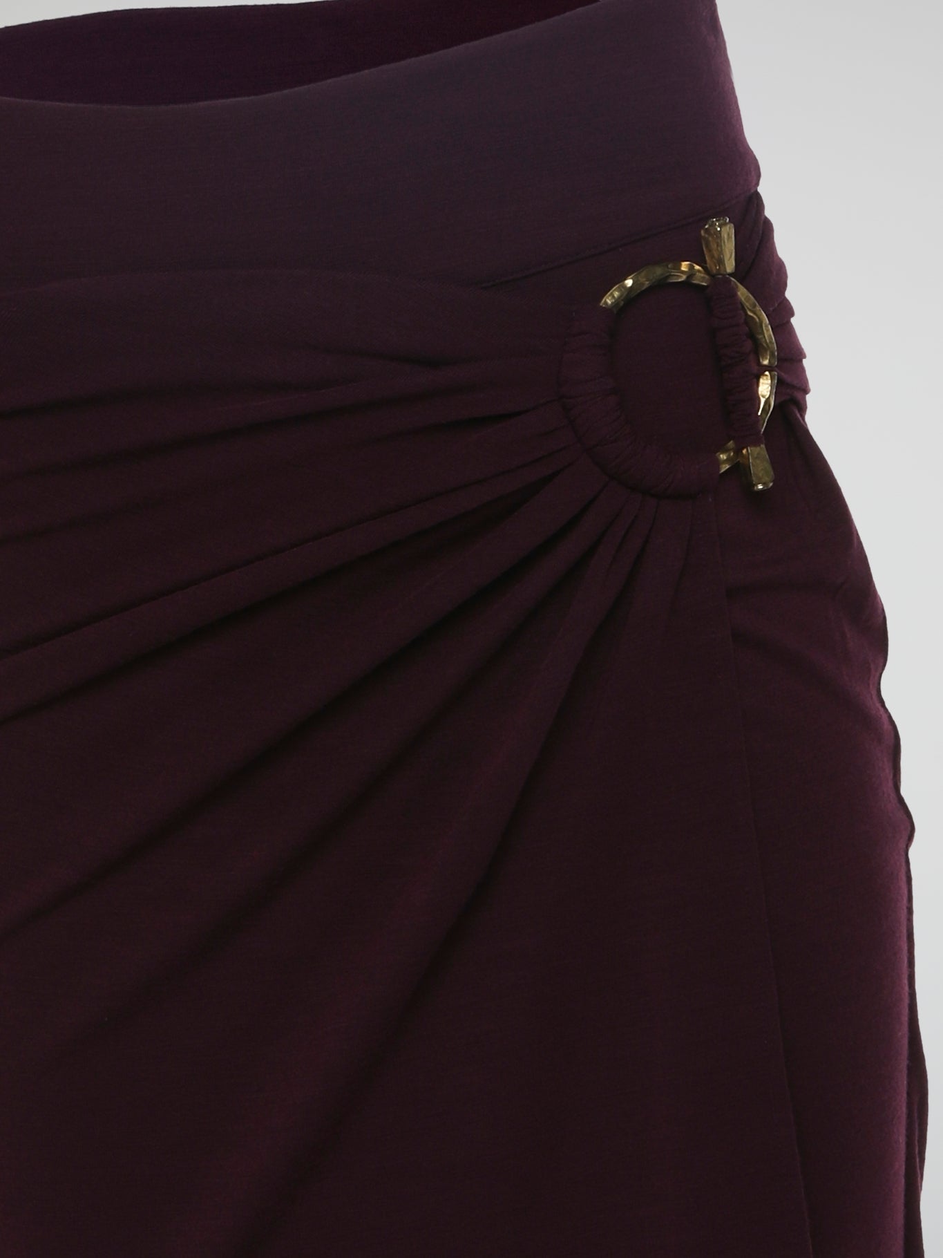 Introducing the Burgundy Draped Skirt by Roberto Cavalli, a graceful masterpiece that effortlessly captivates attention. Crafted with meticulous precision, this luxurious skirt embraces the spirit of elegance, featuring cascading layers that dance with every step. Emanate sophistication and allure as you glide across the room, leaving a trail of admiration in your wake.