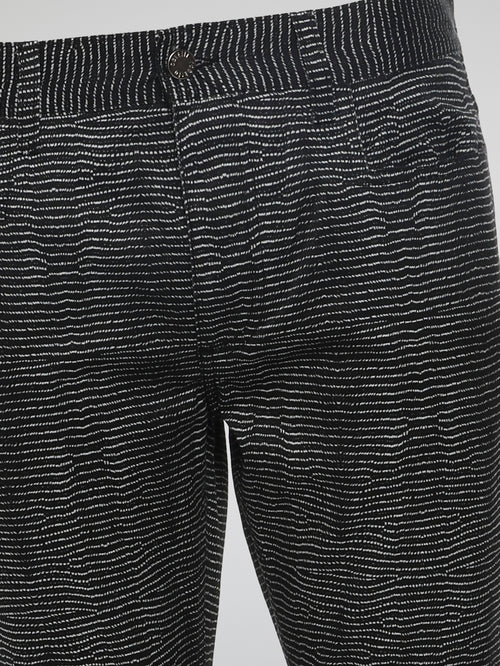 Experience the epitome of style and sophistication with these Black Slim Fit Trousers by Roberto Cavalli. Designed to effortlessly accentuate your silhouette, these trousers are crafted with meticulous attention to detail and precision tailoring. Perfect for any occasion, they exude a sleek and contemporary vibe that will elevate your fashion game to new heights.