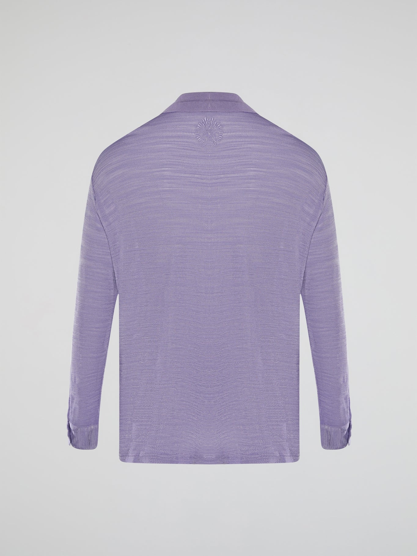 Introducing the Purple Knitted Shirt by Roberto Cavalli, where elegance meets comfort in a seamless blend of style. This luxurious piece features a vibrant hue that showcases your bold personality, while its premium knitted fabric guarantees a heavenly soft touch against your skin. Embrace the epitome of fashion-forward sophistication with this remarkable creation, designed to make heads turn and hearts swoon.