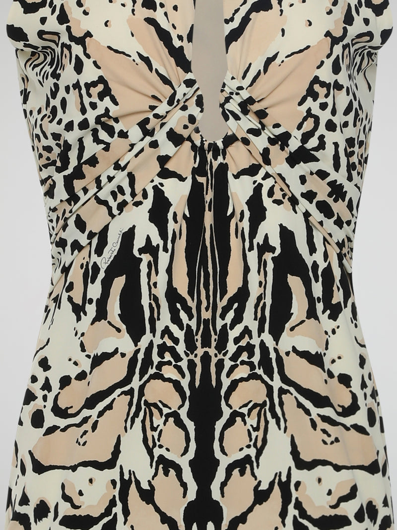 Introducing the Animal Print Keyhole Dress by legendary designer Roberto Cavalli - a fierce and captivating ensemble that will unleash the wild within you. Crafted with exquisite attention to detail, this dynamic piece features a sensuous keyhole neckline and bold animal prints that exude untamed confidence. Pair it with your favorite statement accessories and prepare to make a fierce fashion statement wherever you go.