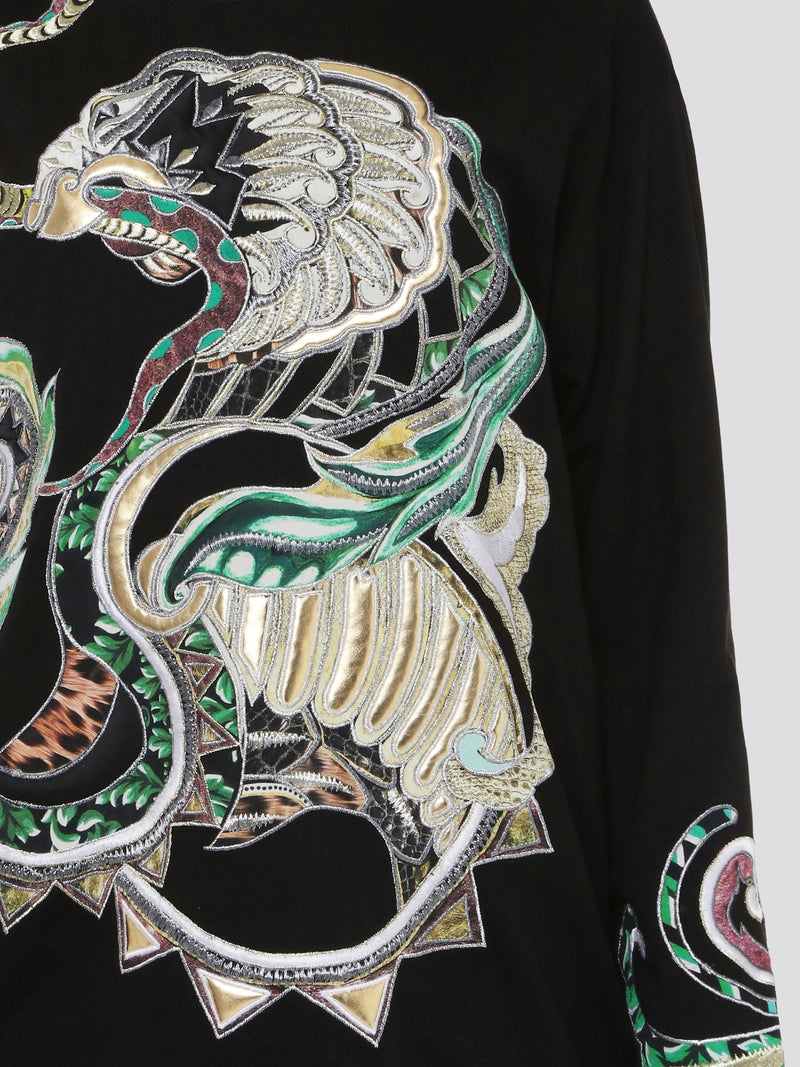 Step out in style and elevate your wardrobe with the Black Embroidered Sweatshirt from Roberto Cavalli. Featuring intricate details and luxurious craftsmanship, this sweatshirt effortlessly blends edgy street style with high-end sophistication. Make a statement and turn heads wherever you go with this must-have piece in your collection.