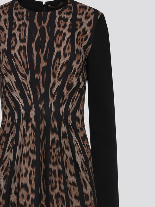 Step into the wild side with our Roberto Cavalli Leopard Print Long Sleeve Dress! This stunning statement piece features a fierce leopard print design that is sure to turn heads wherever you go. Made with high-quality materials, this dress embodies luxury and sophistication, making it the perfect choice for any stylish fashionista. Dress to impress and unleash your inner feline with this captivating Leopard Print Long Sleeve Dress from Roberto Cavalli.