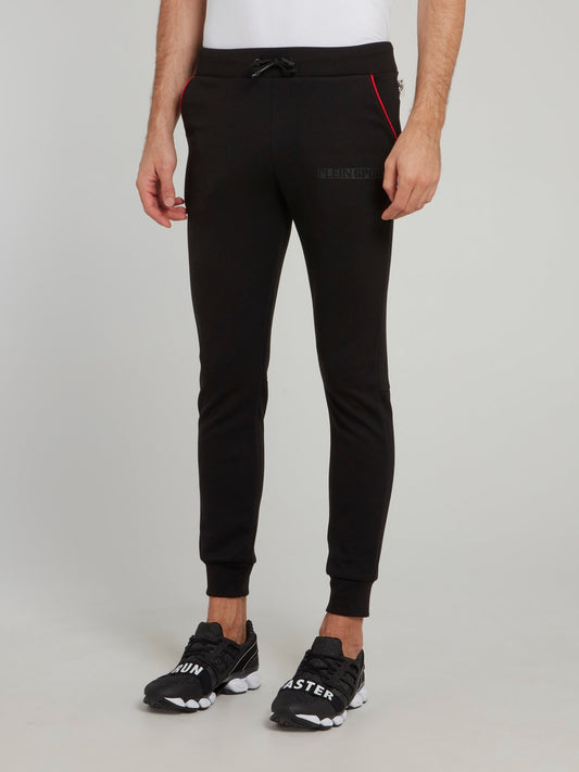 Черные спортивные брюки с красной отделкой