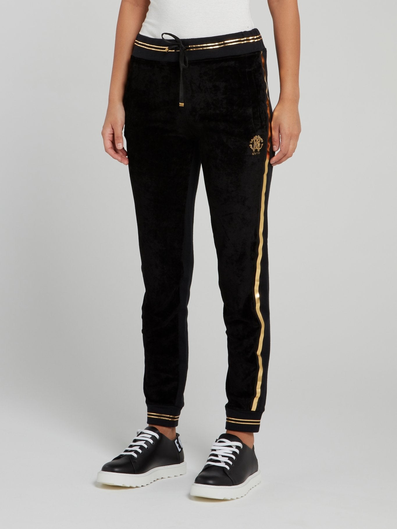 Черные спортивные брюки с золотой полоской