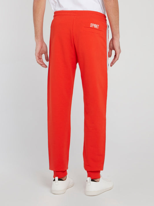 Оранжевые брюки из флиса с лампасами